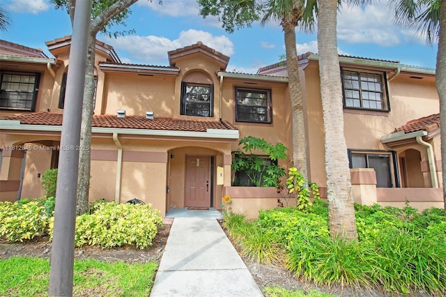 10630 NW 14th St Unit 115, Plantation, FL 33322 - view of front facade featuring stucco siding and a tiled roof