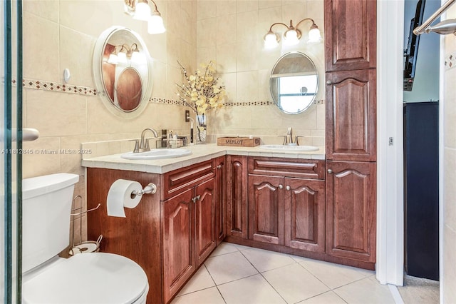 10630 NW 14th St Unit 115, Plantation, FL 33322 - bathroom with double vanity, tile walls, toilet, tile patterned flooring, and backsplash