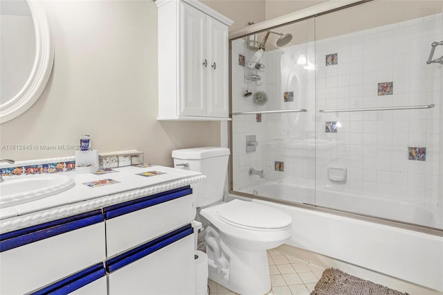 10630 NW 14th St Unit 115, Plantation, FL 33322 - bathroom featuring toilet, tile patterned flooring, combined bath / shower with glass door, and vanity