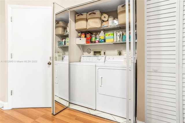 10630 NW 14th St Unit 115, Plantation, FL 33322 - laundry area with separate washer and dryer and light wood-type flooring