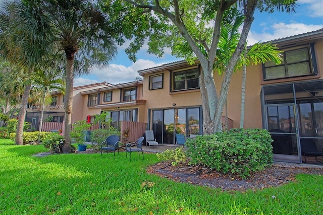 10630 NW 14th St Unit 115, Plantation, FL 33322 - back of house featuring stucco siding and a lawn
