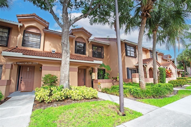 10630 NW 14th St Unit 115, Plantation, FL 33322 - view of front of house with stucco siding and a tiled roof