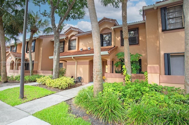 10630 NW 14th St Unit 115, Plantation, FL 33322 - view of front of property featuring stucco siding and a tiled roof