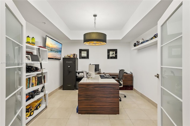 16275 Collins Ave Unit 2101, Sunny Isles Beach, FL 33160 - home office featuring baseboards, a raised ceiling, and light tile patterned flooring