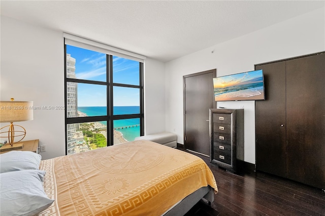 16275 Collins Ave Unit 2101, Sunny Isles Beach, FL 33160 - bedroom featuring wood-type flooring and multiple windows