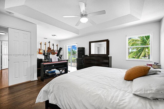 4007 Turquoise Trl, Weston, FL 33331 - bedroom featuring wood finished floors, ceiling fan, and a tray ceiling