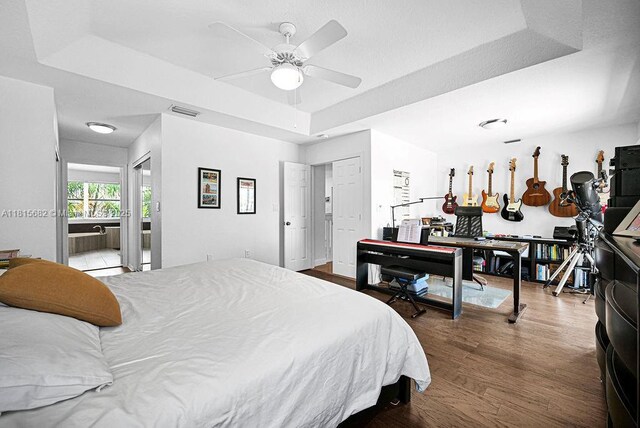 4007 Turquoise Trl, Weston, FL 33331 - bedroom with a raised ceiling and wood finished floors