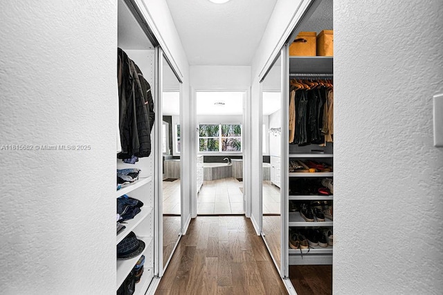 4007 Turquoise Trl, Weston, FL 33331 - spacious closet featuring dark wood-style flooring