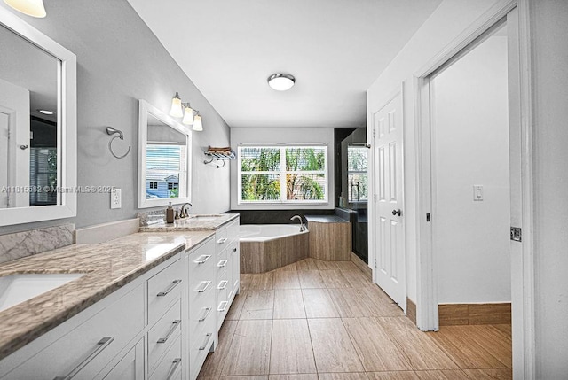 4007 Turquoise Trl, Weston, FL 33331 - full bath featuring double vanity, a bath, and wood finished floors