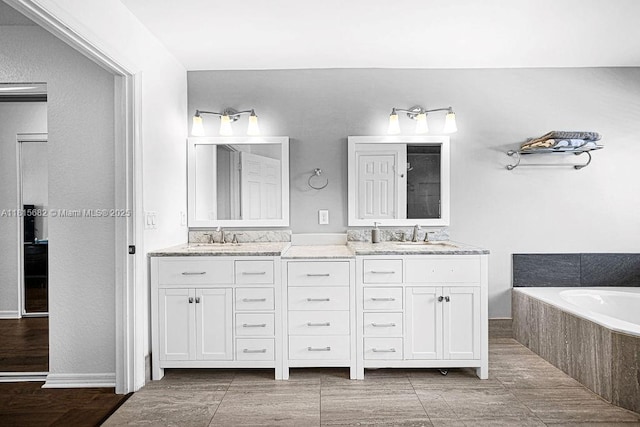 4007 Turquoise Trl, Weston, FL 33331 - bathroom featuring double vanity and a garden tub