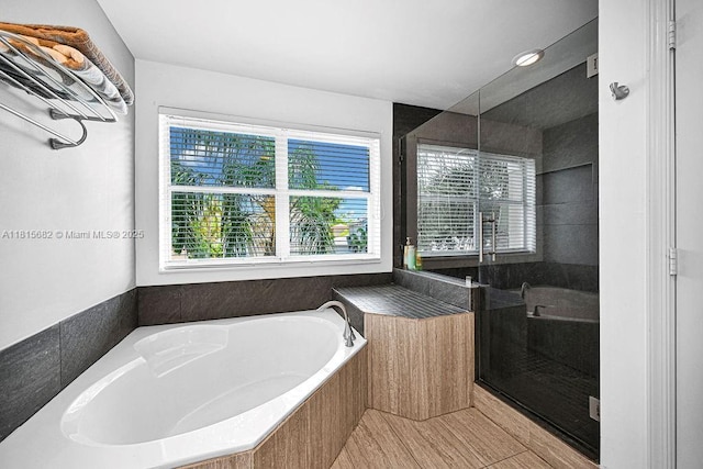 4007 Turquoise Trl, Weston, FL 33331 - bathroom with plenty of natural light, a garden tub, and a shower stall