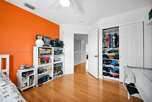 4007 Turquoise Trl, Weston, FL 33331 - bedroom featuring wood finished floors, a closet, and a ceiling fan