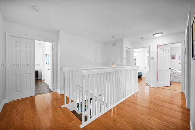 4007 Turquoise Trl, Weston, FL 33331 - corridor with an upstairs landing, wood finished floors, and baseboards