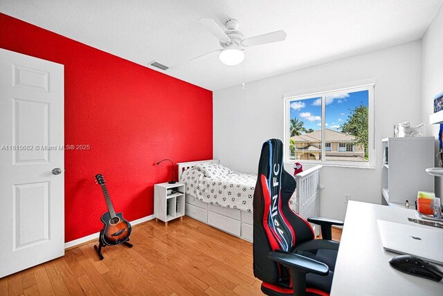 4007 Turquoise Trl, Weston, FL 33331 - bedroom with wood finished floors, a desk, and a ceiling fan
