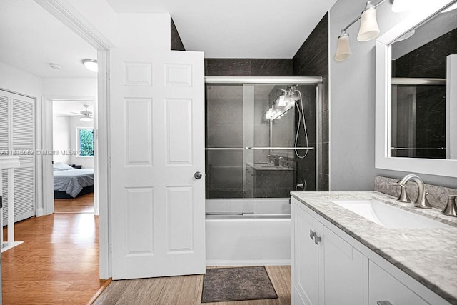 4007 Turquoise Trl, Weston, FL 33331 - bathroom featuring wood finished floors, vanity, enclosed tub / shower combo, ensuite bathroom, and ceiling fan