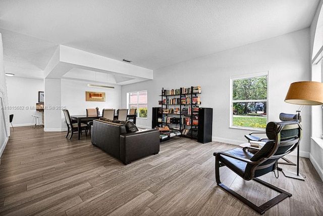 4007 Turquoise Trl, Weston, FL 33331 - living room with wood finished floors, baseboards, and a textured ceiling