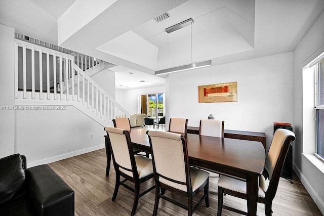 4007 Turquoise Trl, Weston, FL 33331 - dining area with stairs, wood finished floors, healthy amount of natural light, and a raised ceiling