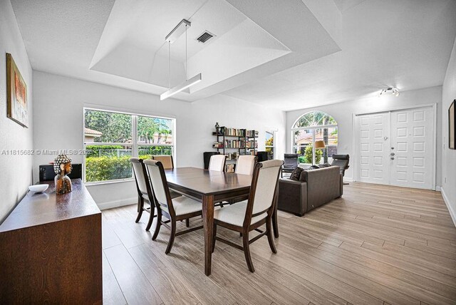 4007 Turquoise Trl, Weston, FL 33331 - dining area with light wood-style flooring and baseboards