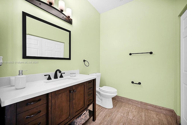 4007 Turquoise Trl, Weston, FL 33331 - bathroom featuring toilet, vanity, and baseboards