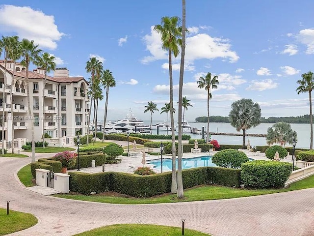 2124 Fisher Island Dr Unit 2124, Miami Beach, FL 33109 - view of community featuring a water view and a swimming pool