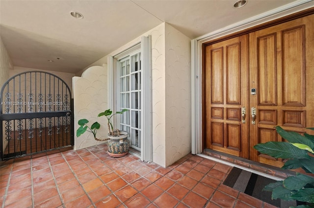 2124 Fisher Island Dr Unit 2124, Miami Beach, FL 33109 - property entrance featuring french doors, stucco siding, and covered porch