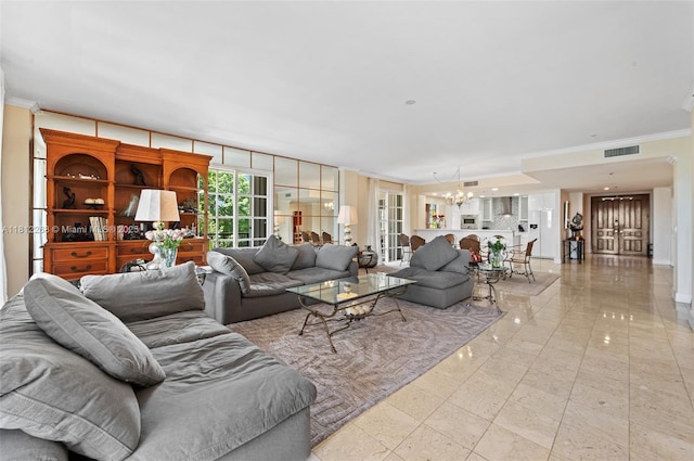 2124 Fisher Island Dr Unit 2124, Miami Beach, FL 33109 - living room featuring a chandelier and crown molding