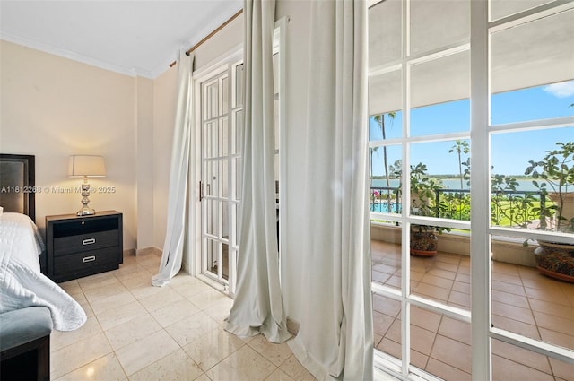 2124 Fisher Island Dr Unit 2124, Miami Beach, FL 33109 - bedroom featuring ornamental molding and light tile patterned flooring