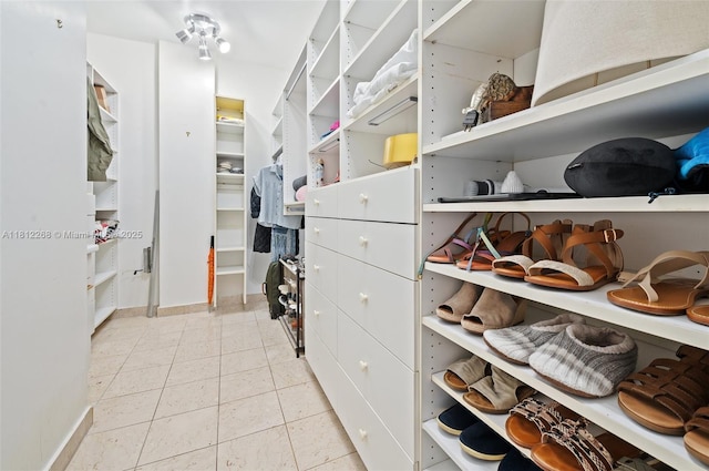 2124 Fisher Island Dr Unit 2124, Miami Beach, FL 33109 - walk in closet with light tile patterned floors