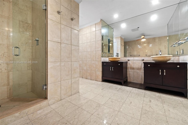 2124 Fisher Island Dr Unit 2124, Miami Beach, FL 33109 - full bathroom with tile walls, a stall shower, vanity, a ceiling fan, and recessed lighting