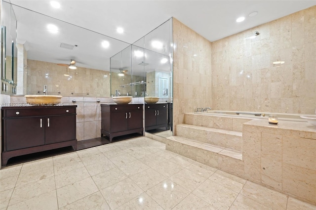 2124 Fisher Island Dr Unit 2124, Miami Beach, FL 33109 - full bathroom with tile walls, two vanities, a bath, and recessed lighting