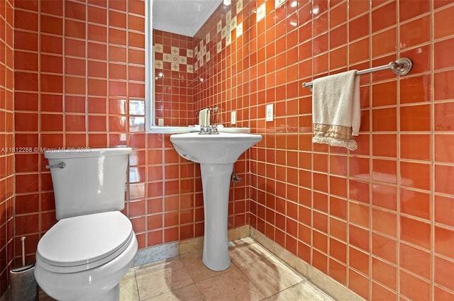 2124 Fisher Island Dr Unit 2124, Miami Beach, FL 33109 - half bathroom with tile walls and ornamental molding