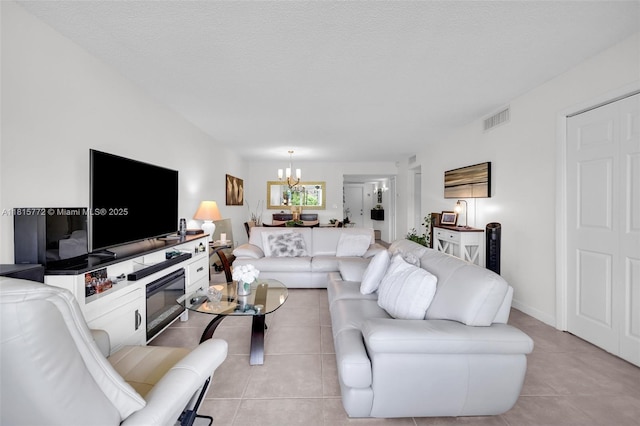 3301 S Palm Aire Dr Unit 106, Pompano Beach, FL 33069 - living room with a chandelier and light tile patterned flooring