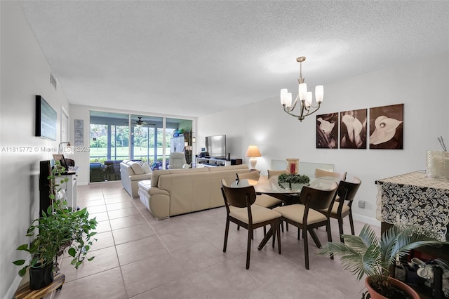 3301 S Palm Aire Dr Unit 106, Pompano Beach, FL 33069 - living area with a chandelier, light tile patterned flooring, and a textured ceiling