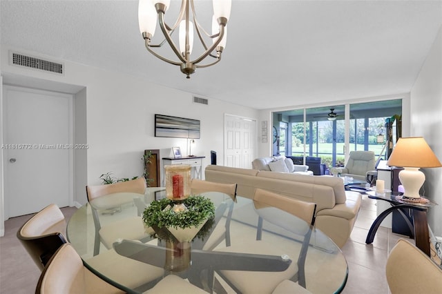 3301 S Palm Aire Dr Unit 106, Pompano Beach, FL 33069 - dining area featuring a chandelier and floor to ceiling windows
