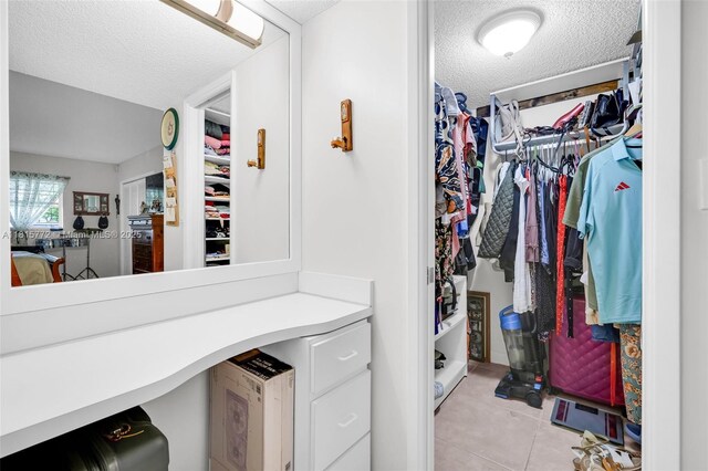 3301 S Palm Aire Dr Unit 106, Pompano Beach, FL 33069 - spacious closet with light tile patterned flooring