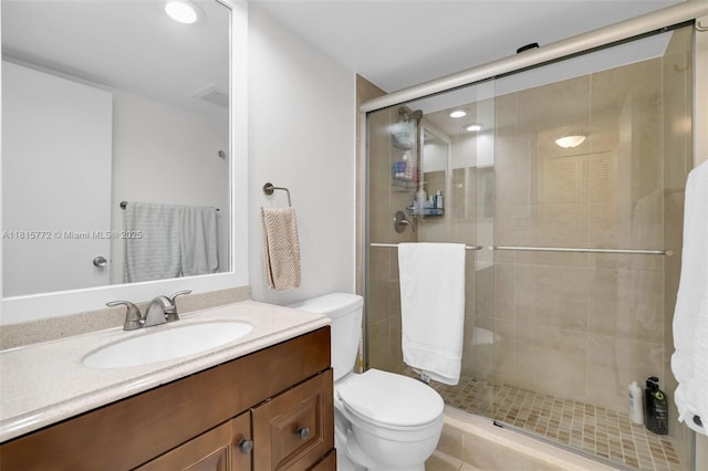 3301 S Palm Aire Dr Unit 106, Pompano Beach, FL 33069 - bathroom featuring toilet, a shower stall, vanity, and recessed lighting
