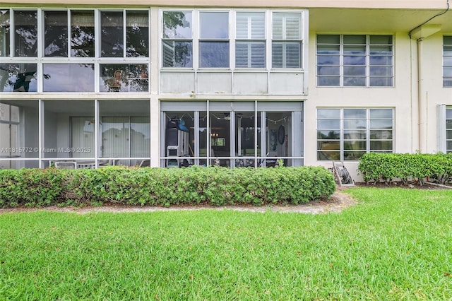 3301 S Palm Aire Dr Unit 106, Pompano Beach, FL 33069 - back of property featuring a lawn