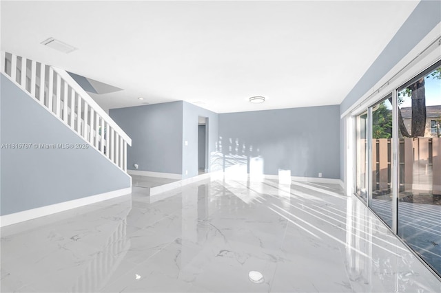 8211 NW 8th St Unit 2, Plantation, FL 33324 - unfurnished room featuring marble tiled floors, baseboards, and stairs