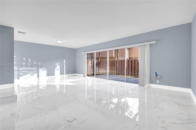8211 NW 8th St Unit 2, Plantation, FL 33324 - empty room featuring marble tiled floors and baseboards