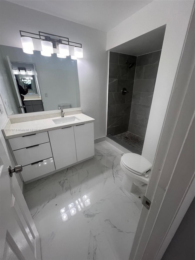 8211 NW 8th St Unit 2, Plantation, FL 33324 - full bathroom featuring marble finish floors, a tile shower, vanity, and toilet