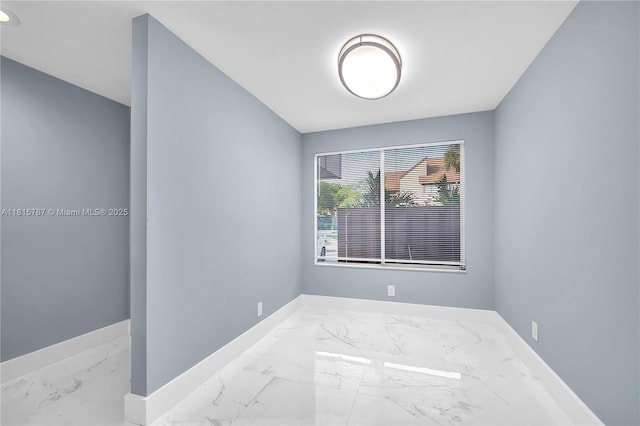 8211 NW 8th St Unit 2, Plantation, FL 33324 - empty room featuring marble finish flooring and baseboards