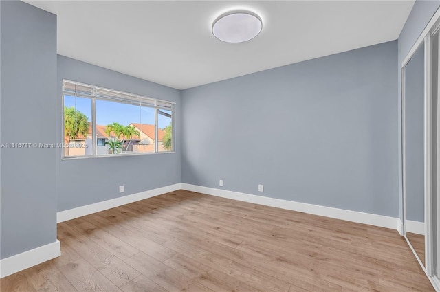 8211 NW 8th St Unit 2, Plantation, FL 33324 - unfurnished room with baseboards and light wood finished floors