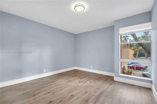 8211 NW 8th St Unit 2, Plantation, FL 33324 - empty room featuring wood finished floors and baseboards