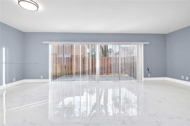 8211 NW 8th St Unit 2, Plantation, FL 33324 - empty room with marble tiled flooring and baseboards