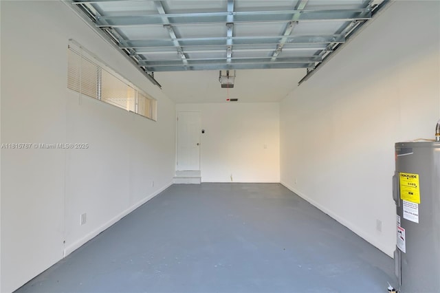 8211 NW 8th St Unit 2, Plantation, FL 33324 - garage with water heater, a garage door opener, and baseboards