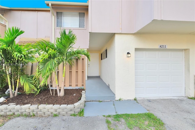 8211 NW 8th St Unit 2, Plantation, FL 33324 - property entrance with stucco siding and a garage