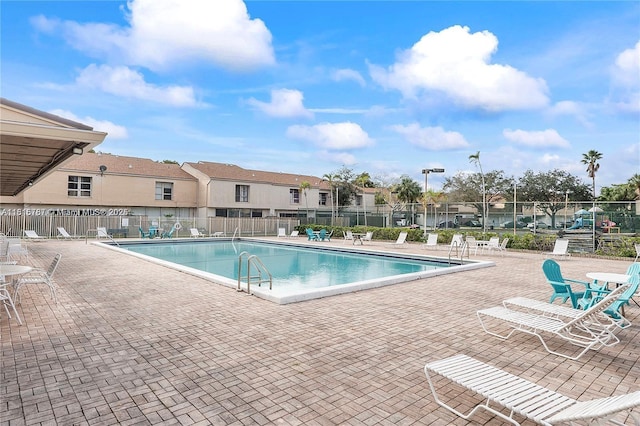 8211 NW 8th St Unit 2, Plantation, FL 33324 - community pool featuring a patio and a residential view