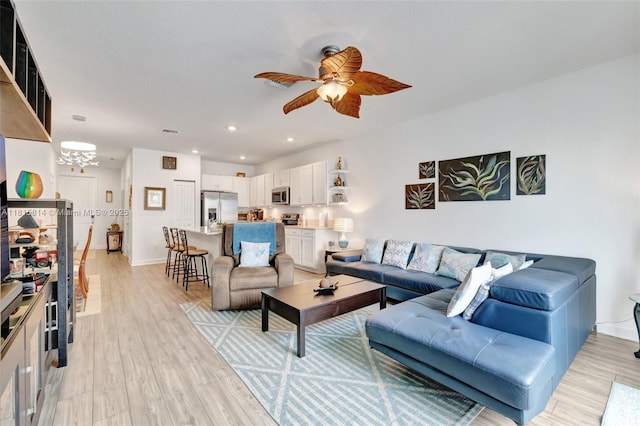 680 SE Lake Falls St, Port St Lucie, FL 34984 - living area with a ceiling fan, light wood-style flooring, baseboards, and recessed lighting