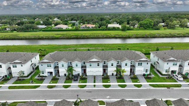 680 SE Lake Falls St, Port St Lucie, FL 34984 - aerial perspective of suburban area featuring a large body of water