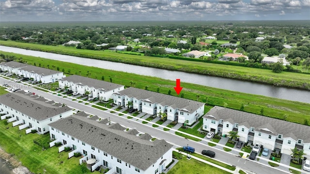 680 SE Lake Falls St, Port St Lucie, FL 34984 - aerial perspective of suburban area featuring a large body of water